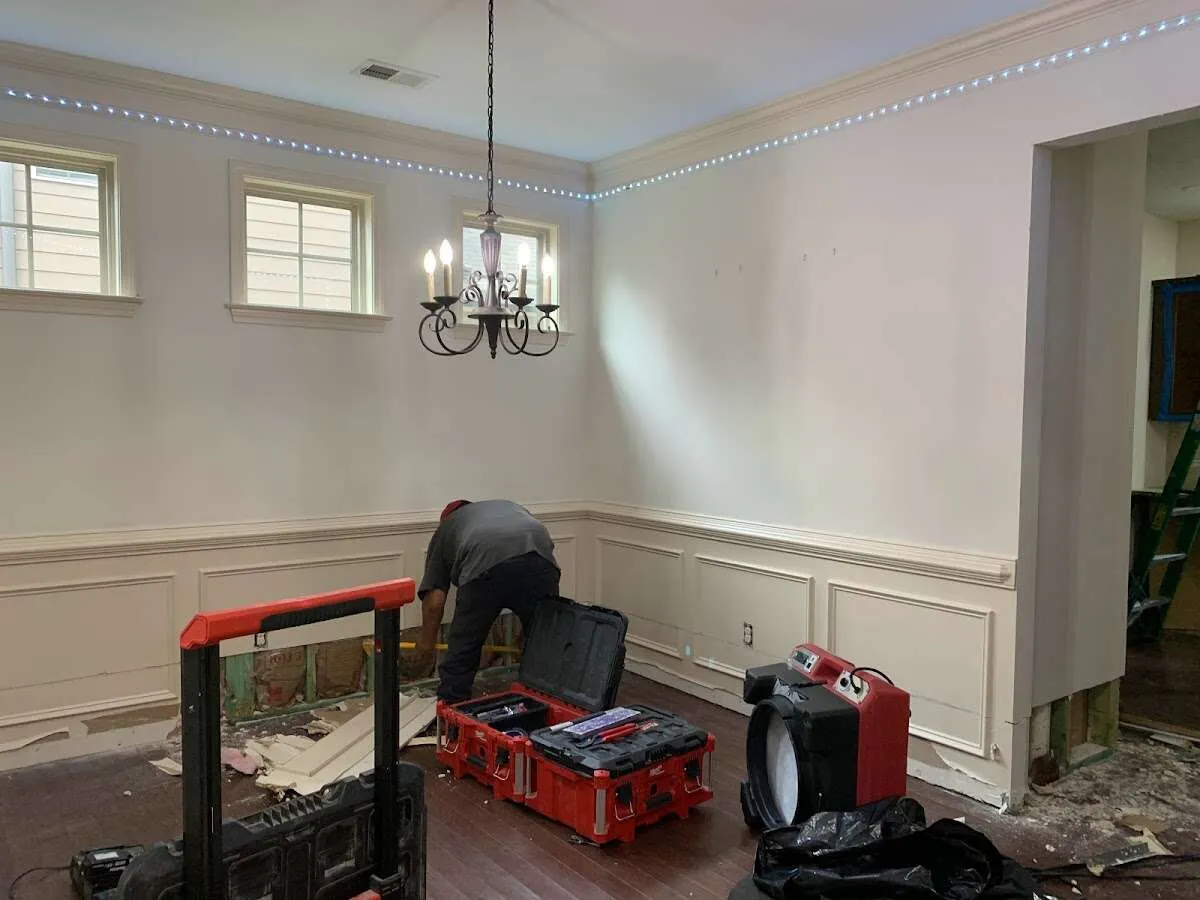 Restoration technician with professional equipment in Lowell
